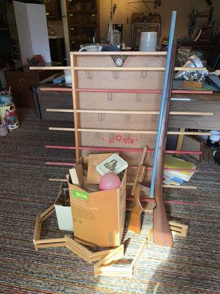 Wooden blocks, fence, guns and early Fooseball table before foose image
