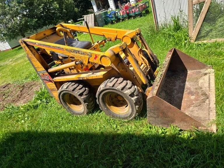 Owatonna Mustang 312 skidloader, new tires, Cage "cab" in Shed. image
