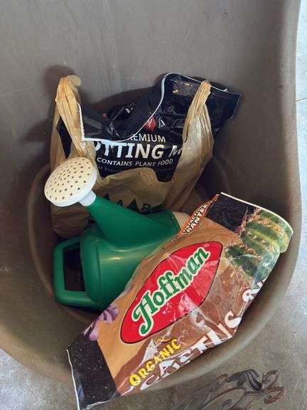 Yard cart, potting soils, plastic water can and decorative art