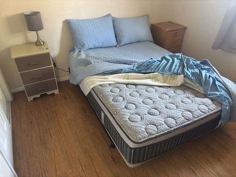 Full size bed with like new extra soft mattress and three drawer side table with lamp image