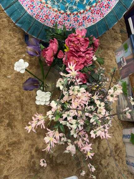 Flower in vases including three glass flowers and a paper umbrella