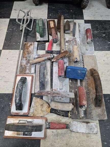 Assorted concrete and tile trowels image