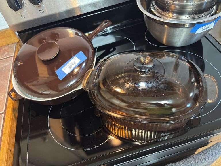 Large cast enamel brown skillet with lid and glass corning covered baking dish image