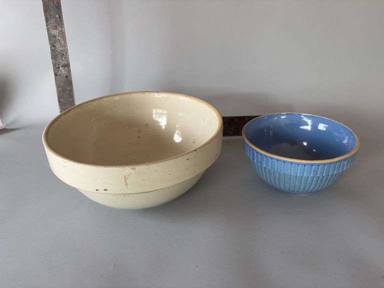 Two stoneware bowls-12” marked RWSCo on bottom and blue 8” vertical ribbed unmarked image