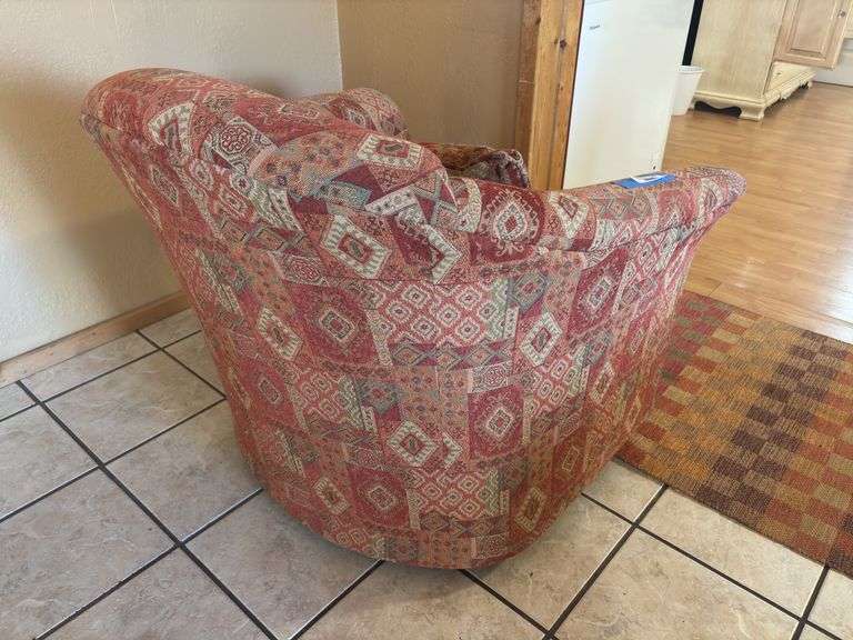 Orange and red toned Southwest style swivel padded armchair