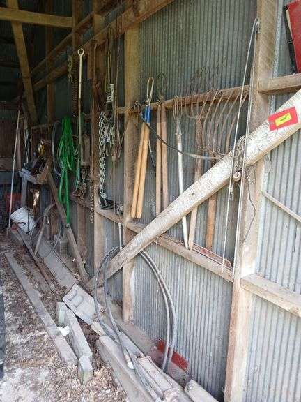 Hog catchers, fence wire, gate hinges, drawbar pins, garden hose, drop hitch receiver and more All on south wall image