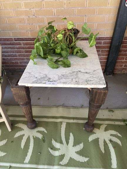 Marble top table and plant image