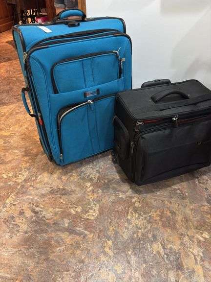 Suitcase and small bag on roller bag image