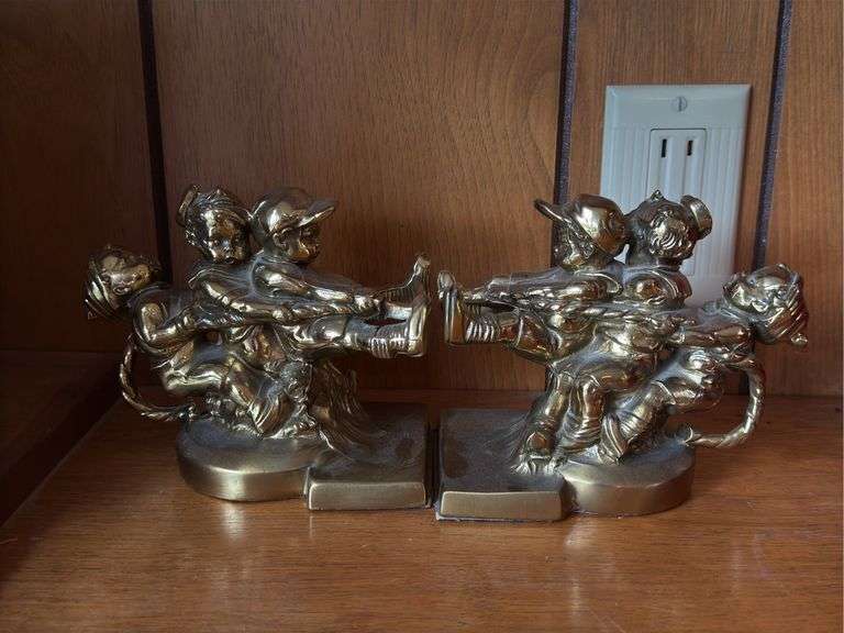 PM Craftsman brass tug of war bookends image