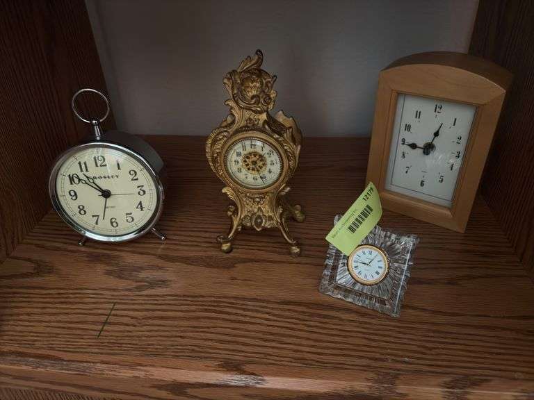 Clocks including a very nice metal ornate wind up clock w/ beveled glass, classic alarm clock