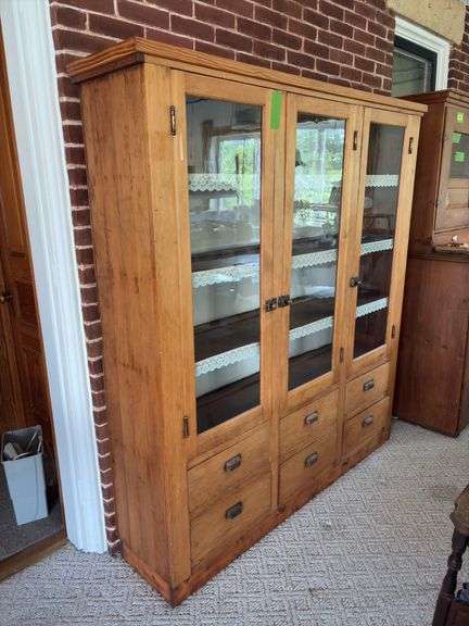 Primitive pine cupboard with triple glass door, square nail, six drawers 15 x 65 x 70” tall image