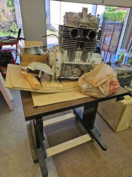 Yamaha Motorcycle Engine with Table (30 x 29) and Roller Dolly image