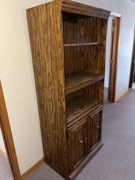 18D x 31L x 75H bookcase with three shelves and double door lower storage image