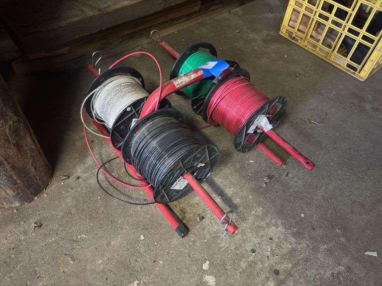 Spool caddy, and four spools of wire image