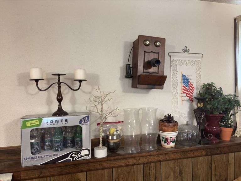 On ledge includes Jones Soda Co Seattle Seahawks collector pack, Easter tree, planters, hurricane shades, etc image