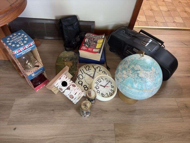 Globe, oil lamp, clocks, bird house, binoculars, AIWA boombox image