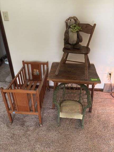 Doll crib, green wicker doll rocker, child’s table and chair image