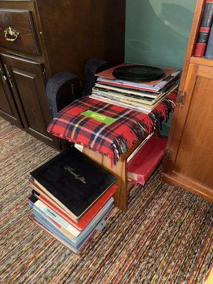 Wooden bench and variety of 78 and LP records image