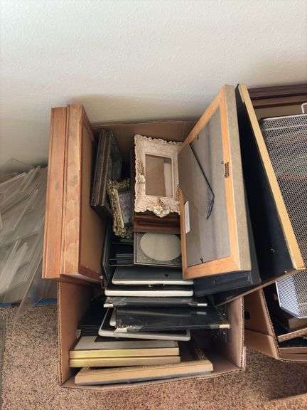 At least a bazillion picture frames. The size you need is in here, maybe 2!