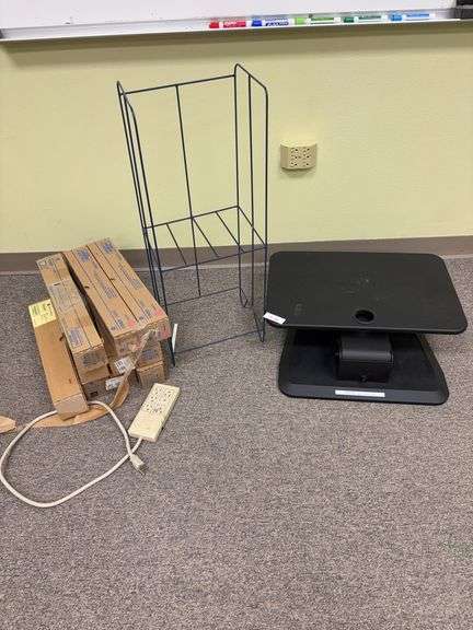 Toner cartridges, metal paper rack, computer rest image