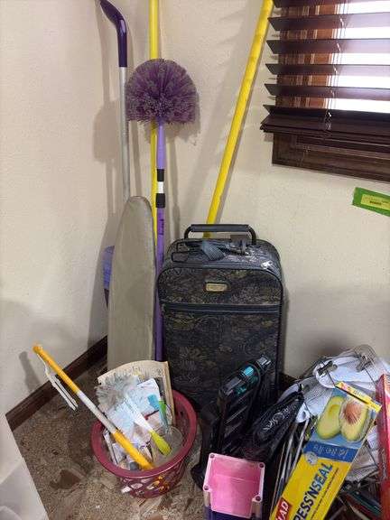 Cleaning supplies, luggage, hangers, paper items, small shelf, laundry soap and more