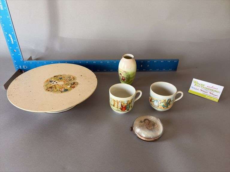 Children’s dishes, paper weight and spinning plate image