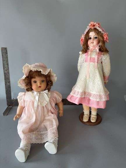 Two composition/bisque dolls Both are jointed, have eye movement One is a cryer Standing doll is an Armand Marseille image