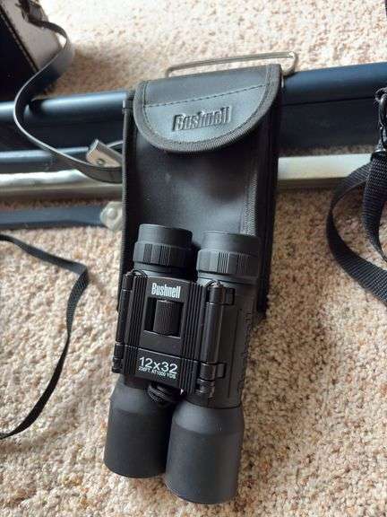 Projector screen, Bushnell 12x32 binoculars, Canon PowerShot A590 digital camera,  Kodak XL33 movie camera