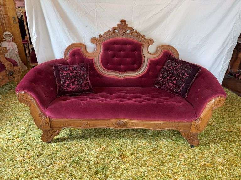 Walnut settee with carved birds and leaves on front of arms, grape medallion on back image