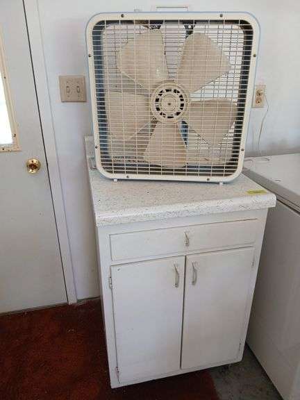 24" wooden base cabinet and box fan