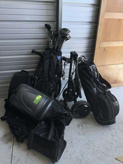 Misc golf clubs, carts and 2 travel bags image