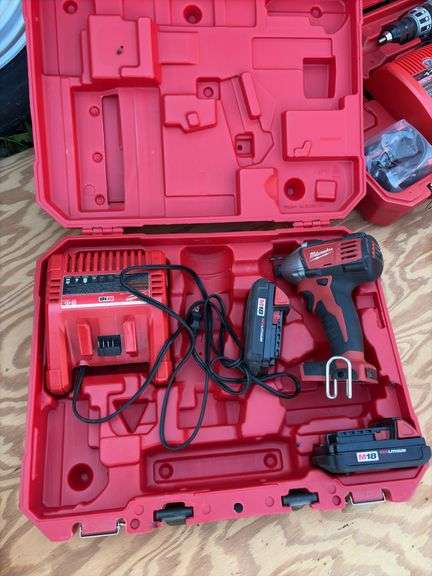 Milwaukee impact driver, 2 batteries and charger image