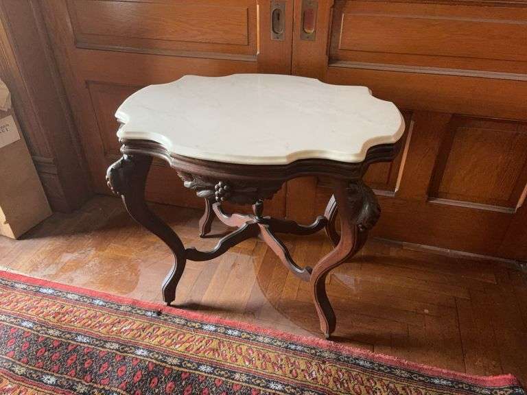 Scalloped edge marble top parlor table with carved fruit accents 24x33x28H image