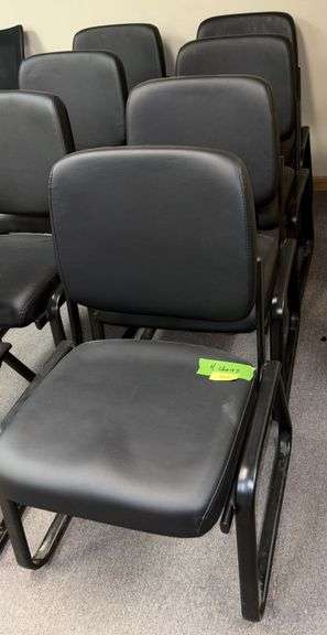 Four matching stationary office chairs image