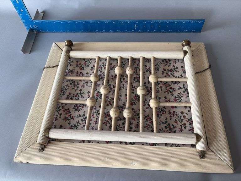 Hanging stick and ball magazine rack image
