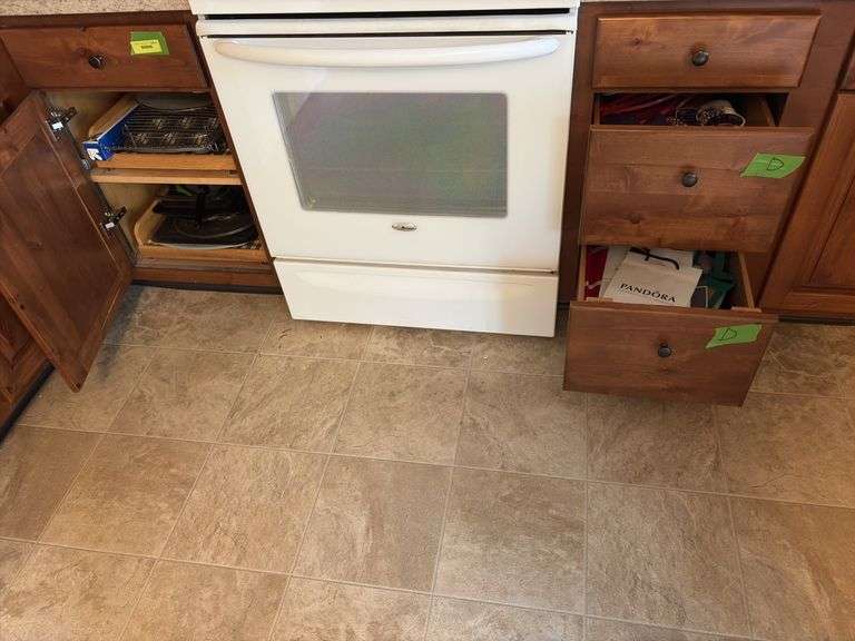 Kitchen linens, bags, baking pans, wire racks “D” cupboards image