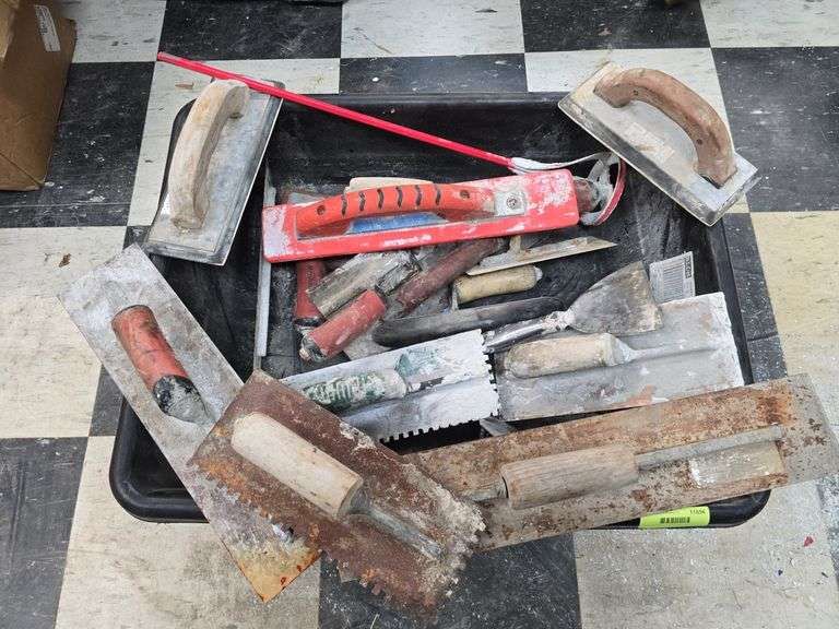 Assorted concrete and tile trowels image
