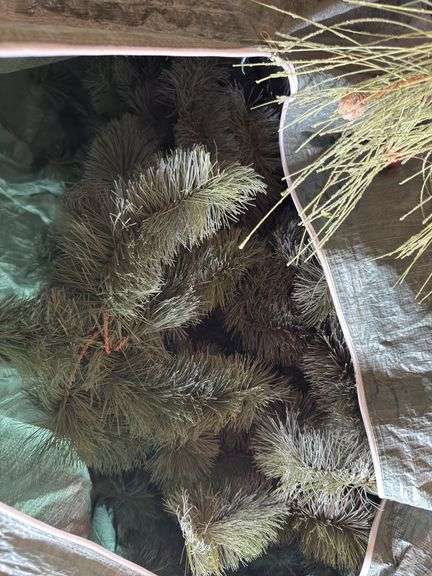 Christmas tree in bag, wreathes, lights, etc