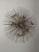 Sunburst style metal wall hanging