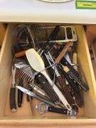 4 kitchen drawers marked "A" with flatware and kitchen utensils