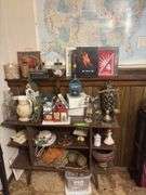 Shelf and contents includes decorative birdhouses, deco scale, bottles, trophies, etc