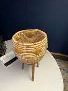 Basket style planter on wooden legs, handmade in Vietnam Approx 22” tall