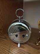 Clocks including a very nice metal ornate wind up clock w/ beveled glass, classic alarm clock