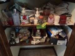 Bottom two shelves includes many candles, soaps, hand towels, etc
