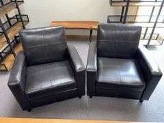 Two pleather arm chairs