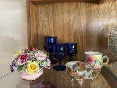 Bone china flowers, HP dishes, large serving bowl etc... All on MIDDLE shelf