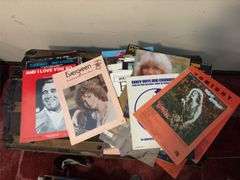 Sheet music and variety of music books, music stand