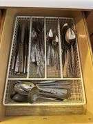 4 kitchen drawers marked "A" with flatware and kitchen utensils