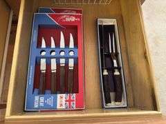 4 kitchen drawers marked "A" with flatware and kitchen utensils