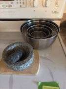 Stainless steel mixing bowls, mortar & pestle, cheese cutting board